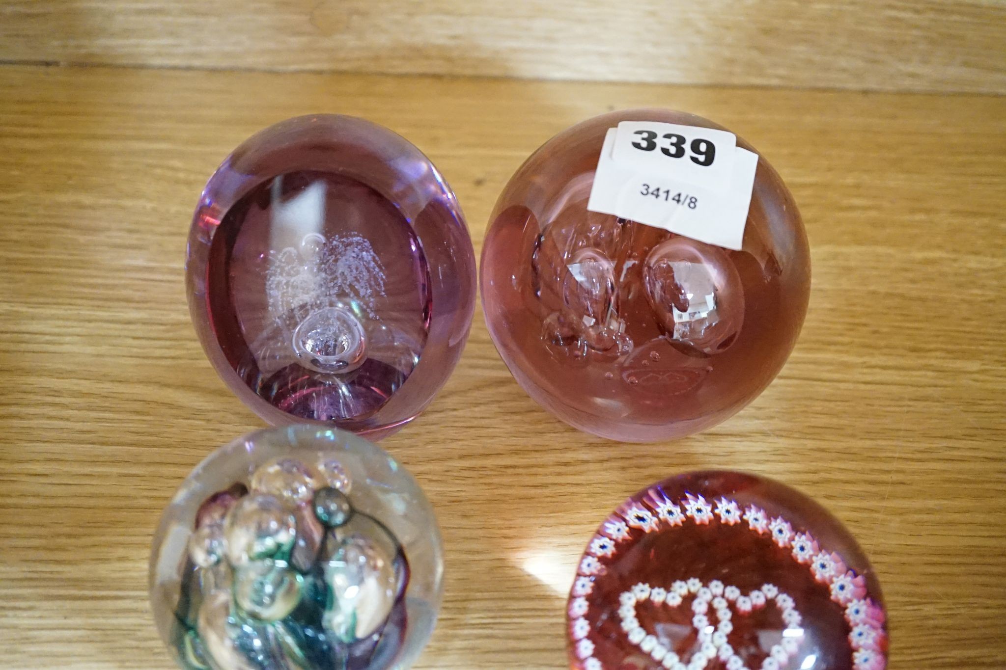 A group of glass paperweights including Caithness